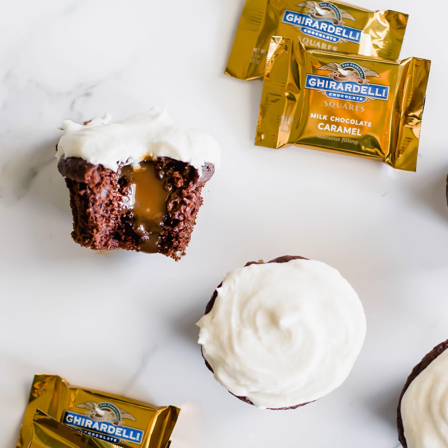 Caramel Stuffed Chocolate Cupcakes feature a super moist and tender chocolate cupcake filled with luscious caramel sauce and topped with vanilla buttercream