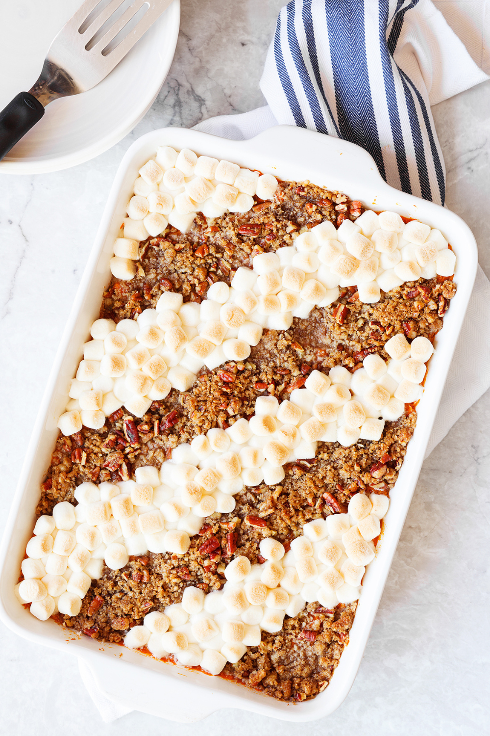 overhead shot of the whole baked Sweet Potato Casserole, showing the attractive and distinct rows of mini marshmallows and pecan streusel. 